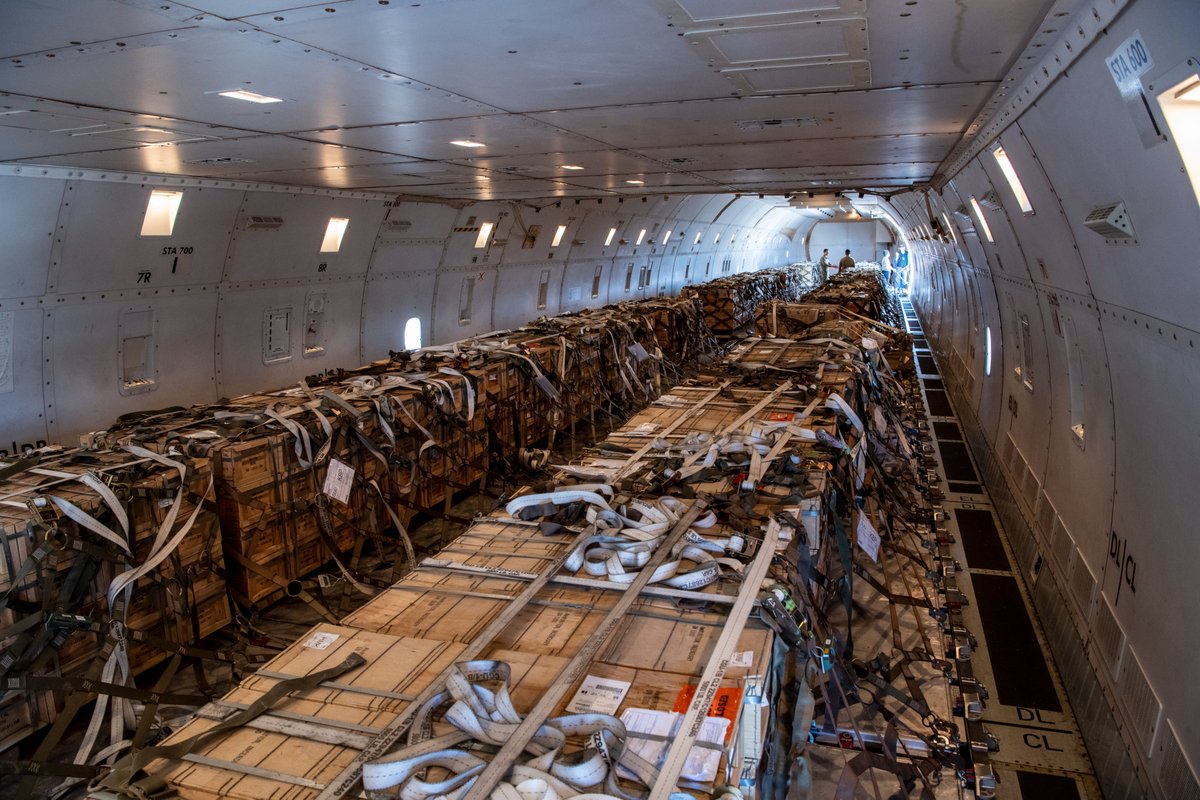 U.S. Airmen from the 60th Aerial Port Squadron load cargo on to a 747 Jan. 22, 2022 at Travis Air Force Base. Lots of .50 caliber ammunition heading to Boryspil International Airport according to the shipping tags