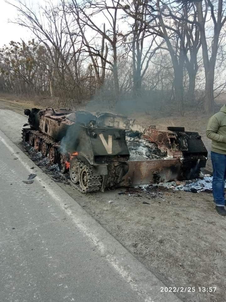 The photo shows a burnt armored vehicle (probably BMD) near the town Bucha (Kyiv region). The identification mark V is clearly visible on the vehicle. The equipment with V mark of the Russian Armed Forces attacks Ukraine from the territory of Belarus