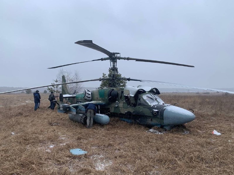 Russian helicopter on the ground after clashes near Babyntsi village in Kyiv region