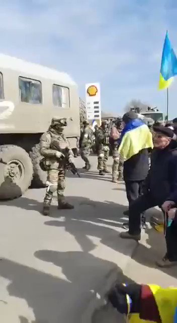 In Bilozerka Russian troops dispersing protesters blocking the way for their convoy with live ammunition