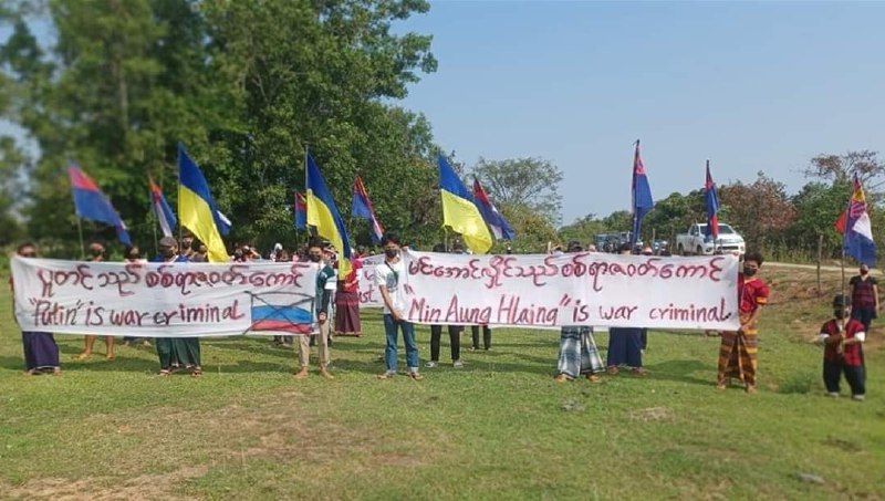 Protesters in Kawkareik, Yangong express support with Ukrainian people, holding banners Min Aung Hlaing and Putin are war criminals posters