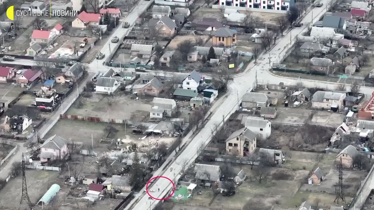 New drone imagery shows Russian forces firing on a cyclists in Bucha, on Yablunska Street at 50.54148, 30.228898, where multiple corpses have been filmed and photographed
