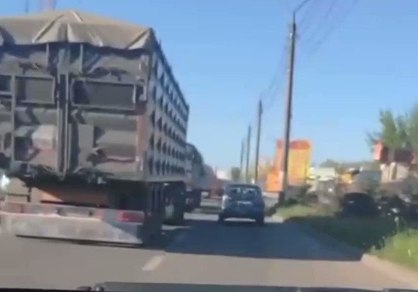Truckloads of grain being carried off toward Russia from Russian occupied Melitopol. Russia stealing Ukrainian grain