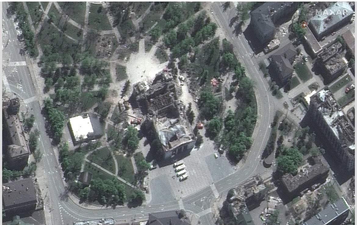 An extensive excavation of the bombed Mariupol drama theater is underway, new satellite images from Maxar Technologies show. The images, taken on May 6, show a crane and trucks at the site