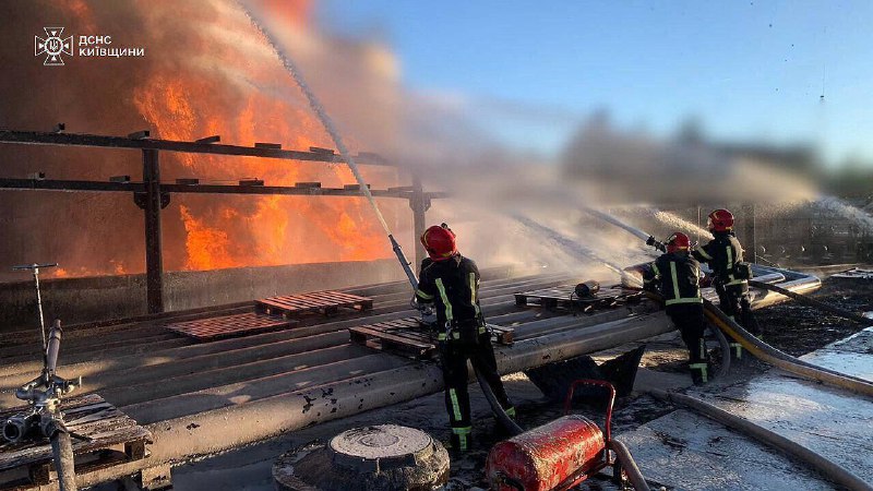 Firefighters in Kyiv region extinguishing the fire at industrial enterprise, caused by debris of Russian missile for a day