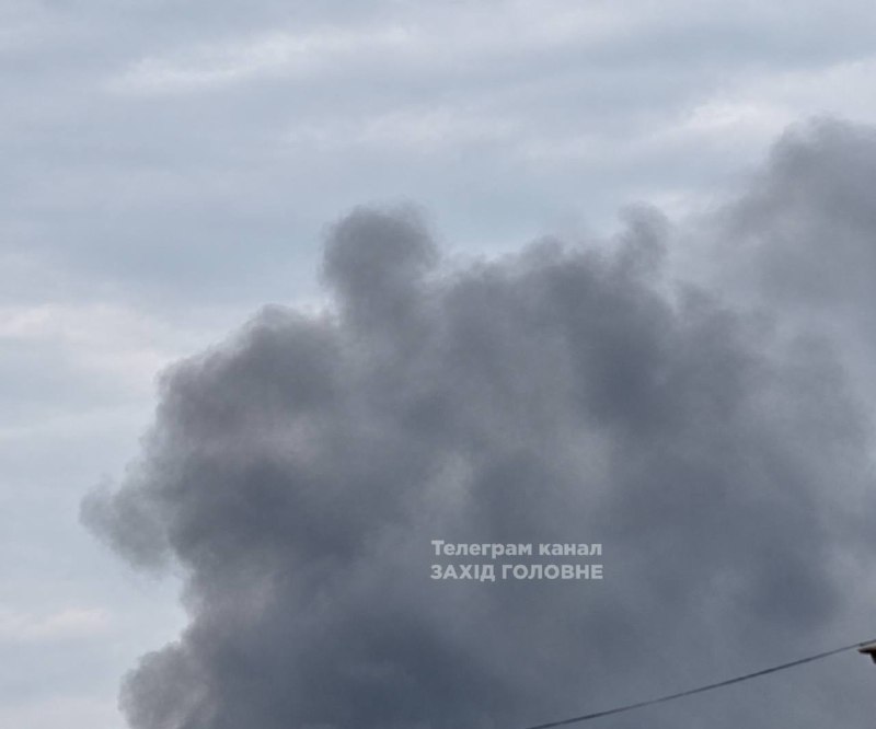 A column of smoke rises in Zhytomyr after an attack.